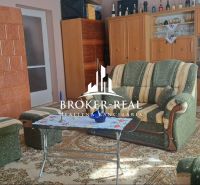 Interior of a family house with carpet decor, fireplace, and traditional furniture.