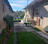 A family house in Gönc with a yard, flower pots, and a lawn offers a peaceful atmosphere.
