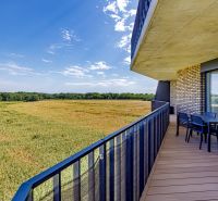 The balcony of a 3-room apartment on Fialová in Bratislava - Petržalka with a view of the field.