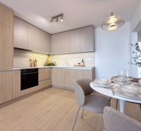 A kitchen with light cabinets and a wood-patterned floor in a three-room apartment.