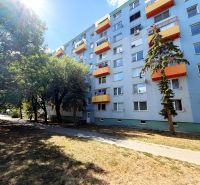 Apartment building on Lúky Street in Vráble with orange balconies.