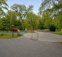Playground and play area on Nobelova Street in Bratislava surrounded by trees.