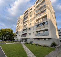 Apartment building on Nobelova Street in Bratislava with a landscaped lawn in front of the building.