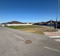 A plot for residential use in Most pri Bratislave surrounded by a road and new development.