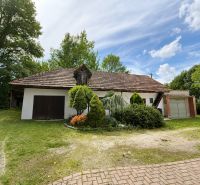Family house in Klačany in Urmince with a garage and greenery in the front garden.