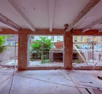 Reconstruction of commercial premises on Sládkovičova Street in Nitra with open walls.