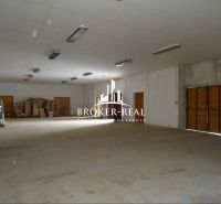 Warehouses and halls with packages and wrappers on the floor, wooden doors, lighting from the ceiling.