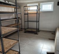 A warehouse with metal shelves and tiles in a family house.