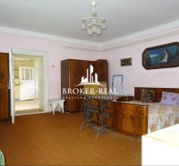 Interior of a family house with retro furniture and textile accessories.