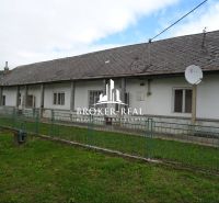 A family house in Černochov, surrounded by greenery, with a satellite dish on the roof.