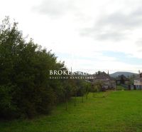 A family house in Černochov surrounded by greenery with a view of the surrounding countryside.