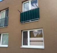 The facade of the building on Tehelná in Pezinok, Studio apartment with two windows.