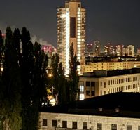 Evening view of an illuminated high-rise building in Bratislava, Nové Mesto on Sliačska Street.