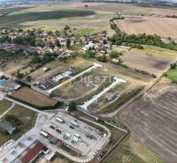 Aerial view of land - housing in Rovensko surrounded by agricultural landscape.