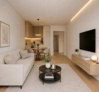 A bright living space in a two-room apartment with a wooden decor floor and modern furnishings.