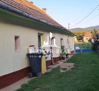 A family house in Gönc with a traditional roof and a landscaped exterior in a quiet street.