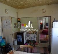 A kitchen in a family house with antique furniture, carpets, and kitchen accessories.