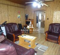 Interior of a family house with leather sofas and a wooden decor floor.