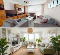 Living room in a family house with a wooden decor floor, comfortable sofas, and decorations.