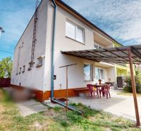A family house in Brodské on 1st May Street with a terrace and garden seating.