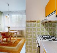 A kitchen in a family house with retro tiles, a table, and a clock on the wall.