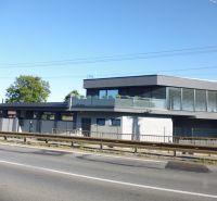 The exterior of the building in Kračúnovce with glass railings and modern design.