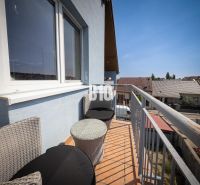 The balcony of a 2-room apartment in Bratislava III with a view of the rooftops.