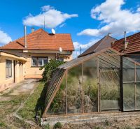 A family house in Oslany with a spacious garden and a greenhouse.