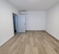 A place with a wooden floor decor, air conditioning, and open doors in Offices.