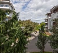 Apartment buildings surrounded by greenery on Hriňovská, Bratislava - Staré Mesto.