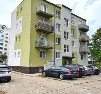 Apartment building with balconies on Andrusovova Street in Bratislava - Petržalka, next to the parking lot.