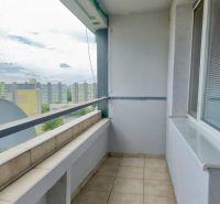 A balcony in a 3-room apartment on Gessayova Street in Bratislava - Petržalka with tiles and a railing.