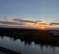 A view of the sunset from Manckovičova Street in Hlohovec by the river.