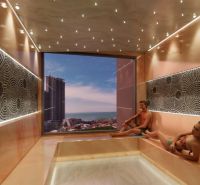 Relaxation room in a recreational apartment with a view of the city and ocean in Jomtien.