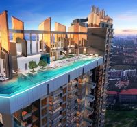 Rooftop pool of the Jomtien Holiday Apartment with panoramic city views.