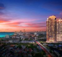 View of the recreational apartment tower in Jomtien, sunset over the sea.