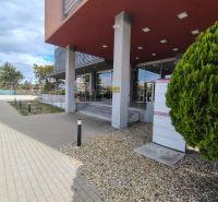 Entrance to the offices on Bajkalská Street in Bratislava – Ružinov with parking and greenery.