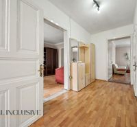 In the interior of the family house, there is a hallway with a wooden decor floor and a wardrobe.