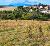 Land - living in Jarabina, surrounded by hills and colorful houses in the countryside.