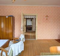 Interior of a family house with a wooden decor floor and vintage wallpapers.