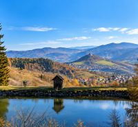 Autumn landscape with a pond and mountain view near Banská Štiavnica.