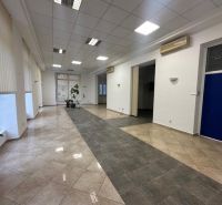 Spacious commercial premises with tiles and office partitions.