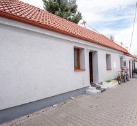 A family house on Roľnícka Street in Bratislava - Vajnory with a red roof and bicycles.