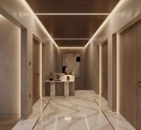 A hallway in a family house with a marble floor and a wooden ceiling.