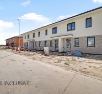 A family house in Dolný Bar during construction work, showing multiple residential units.