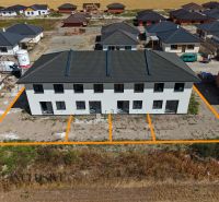 A family house in Dolný Bar near other properties on an extensive construction site.