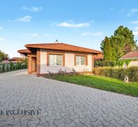 A family house on Kostolné Kračany Street in Dunajská Streda with a landscaped garden and driveway.