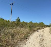 Agricultural and forest land near Kučišdorfská Street in Pezinok with electrical wiring.