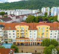 Buildings on Moyzesova Street in Púchov with commercial spaces on the ground floor.