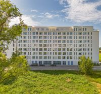 Apartment building on Labutia Street in Bratislava - Petržalka surrounded by greenery and nature.